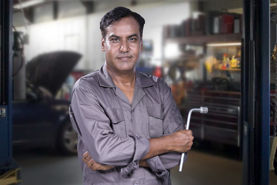 Professional auto glass technician smiling